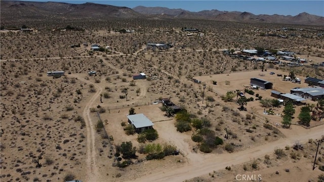 1240 Geronimo Trl, Yucca Valley, CA 92284 - view of property location with a desert landscape, a mountain backdrop, and rural landscape