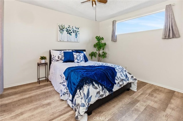 309 N Raitt St Unit C, Santa Ana, CA 92703 - bedroom with wood finished floors, baseboards, a textured ceiling, and a ceiling fan