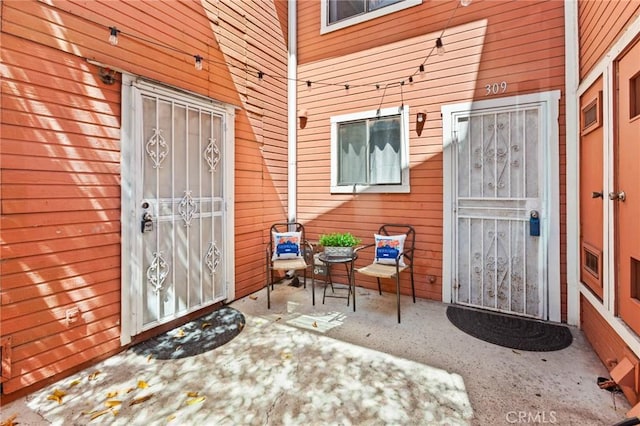 309 N Raitt St Unit C, Santa Ana, CA 92703 - view of exterior entry with a patio area