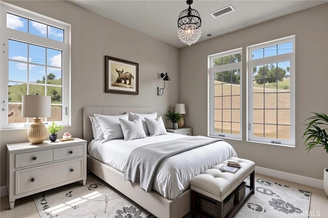 29300 Horsethief Dr, Tehachapi, CA 93561 - bedroom with a chandelier, baseboards, and light colored carpet