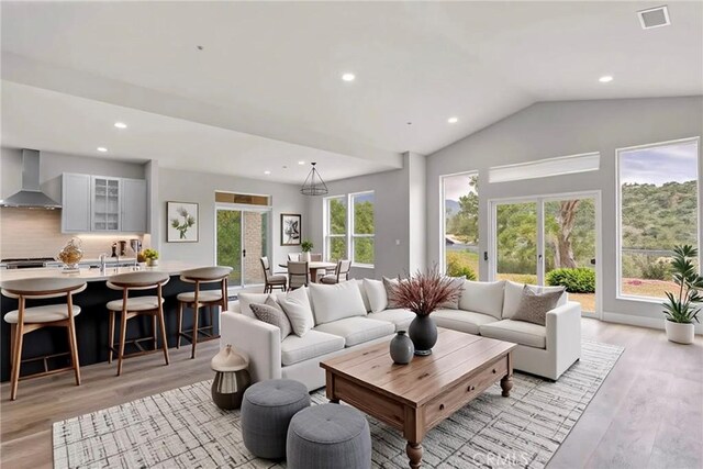 29300 Horsethief Dr, Tehachapi, CA 93561 - living area with light wood-type flooring, recessed lighting, and vaulted ceiling