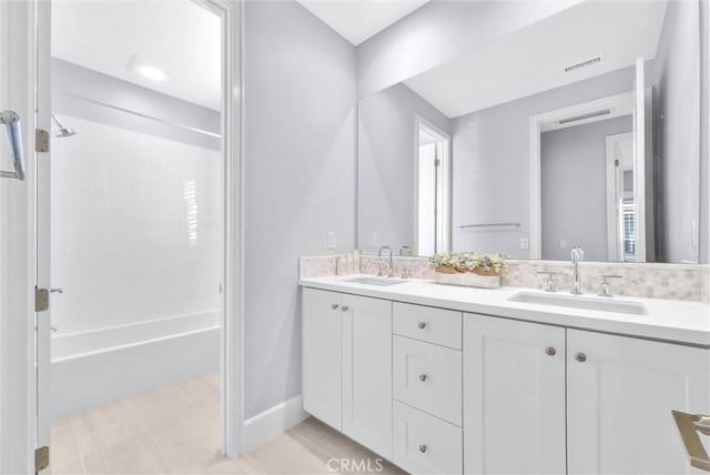 211 Fiore, Irvine, CA 92602 - bathroom with double vanity, tile patterned floors,  shower combination, and baseboards