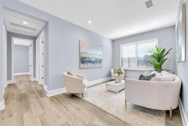 211 Fiore, Irvine, CA 92602 - living room featuring light wood-style floors, baseboards, and recessed lighting