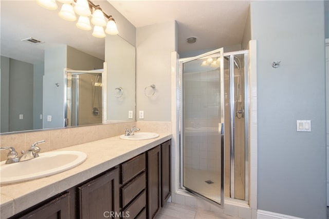 39883 S Creek Cir, Murrieta, CA 92563 - bathroom featuring a stall shower, double vanity, a chandelier, and tile patterned flooring