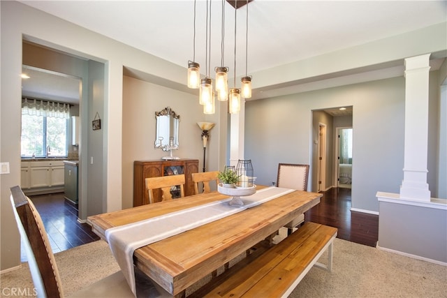 39883 S Creek Cir, Murrieta, CA 92563 - dining room featuring decorative columns, dark wood-style flooring, and baseboards