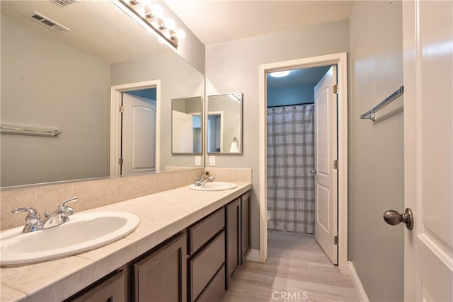 39883 S Creek Cir, Murrieta, CA 92563 - full bath featuring double vanity, wood finished floors, and baseboards
