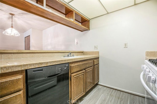 465 Ivy St Unit 203, Glendale, CA 91204 - kitchen with dishwasher, light wood-type flooring, white range with gas stovetop, baseboards, and decorative light fixtures