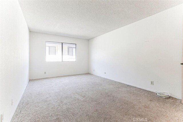 465 Ivy St Unit 203, Glendale, CA 91204 - unfurnished room with carpet and a textured ceiling