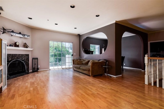 1515 Indiana Ave, South Pasadena, CA 91030 - living area featuring light wood-style floors, ornamental molding, a premium fireplace, baseboards, and recessed lighting