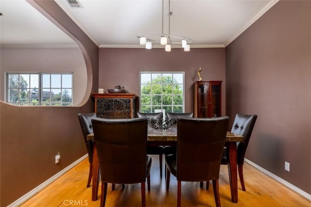 1515 Indiana Ave, South Pasadena, CA 91030 - dining space with wood finished floors, baseboards, and crown molding
