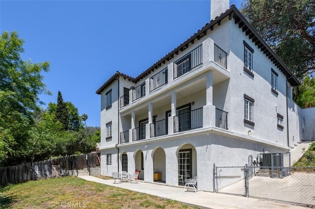 1515 Indiana Ave, South Pasadena, CA 91030 - rear view of property featuring a balcony, a gate, a chimney, stucco siding, and a patio