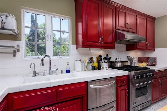 1515 Indiana Ave, South Pasadena, CA 91030 - kitchen featuring under cabinet range hood, stainless steel appliances, a sink, and dark brown cabinets