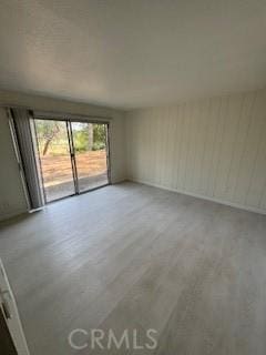 22425 Caminito Grande Unit 70, Laguna Hills, CA 92653 - empty room with light wood-style floors