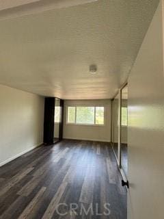 22425 Caminito Grande Unit 70, Laguna Hills, CA 92653 - unfurnished room featuring wood finished floors and baseboards