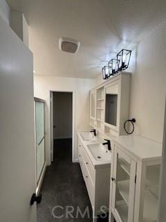 22425 Caminito Grande Unit 70, Laguna Hills, CA 92653 - full bathroom with double vanity and a shower with door