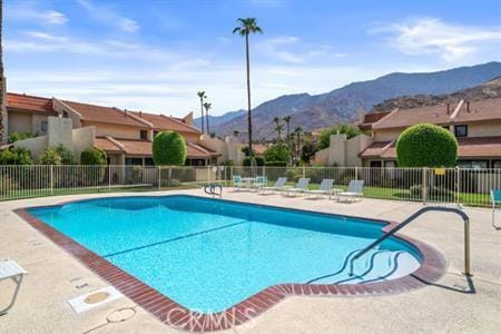 2600 S Palm Canyon Dr S Unit 21, Palm Springs, CA 92264 - community pool featuring a mountain view and a patio area