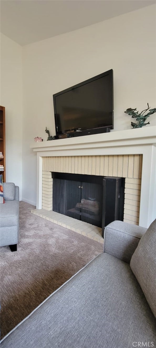 2600 S Palm Canyon Dr S Unit 21, Palm Springs, CA 92264 - detailed view of a fireplace, carpet floors, and baseboards