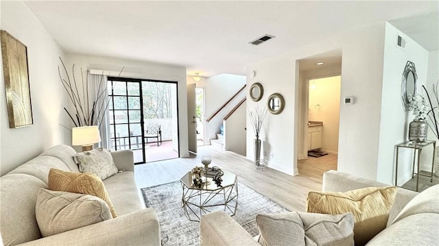 2971 Plaza Del Amo Unit 243, Torrance, CA 90503 - living area with stairs, light wood finished floors, and baseboards
