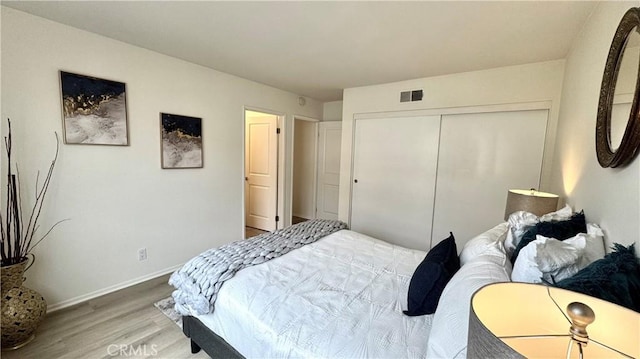 2971 Plaza Del Amo Unit 243, Torrance, CA 90503 - bedroom featuring light wood-type flooring, a closet, and baseboards