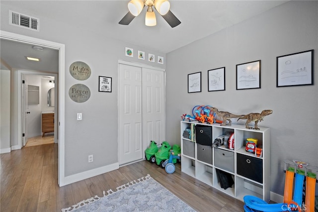 2251 Via Pacifica, Corona, CA 92882 - game room with a ceiling fan, wood finished floors, and baseboards