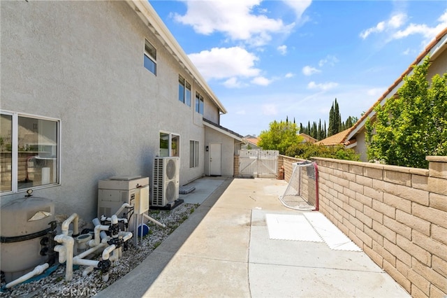 2251 Via Pacifica, Corona, CA 92882 - view of patio / terrace featuring a gate and a cooling unit