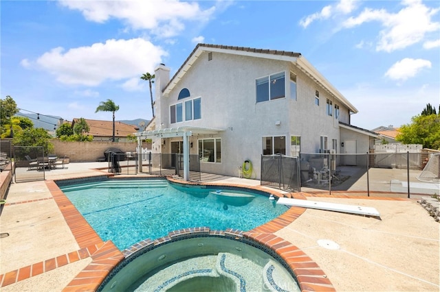 2251 Via Pacifica, Corona, CA 92882 - view of pool featuring a patio, a pergola, a pool with connected hot tub, and a diving board
