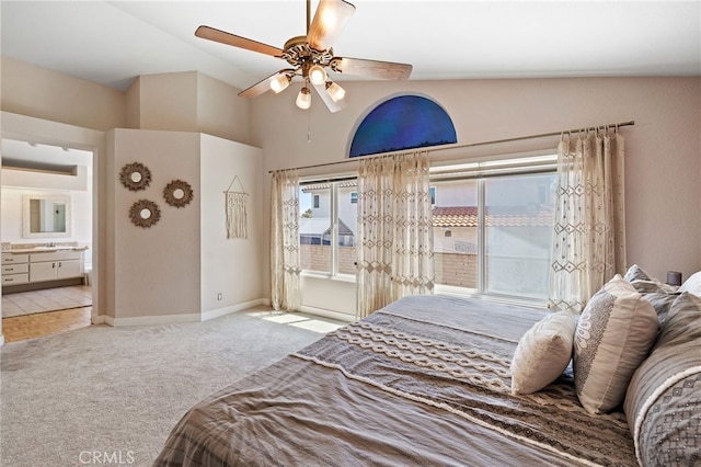 2251 Via Pacifica, Corona, CA 92882 - carpeted bedroom with vaulted ceiling, access to exterior, ensuite bath, a ceiling fan, and baseboards