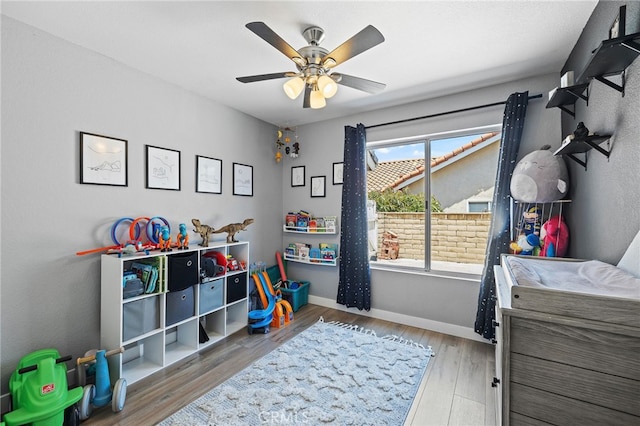 2251 Via Pacifica, Corona, CA 92882 - rec room with a ceiling fan, wood finished floors, and baseboards