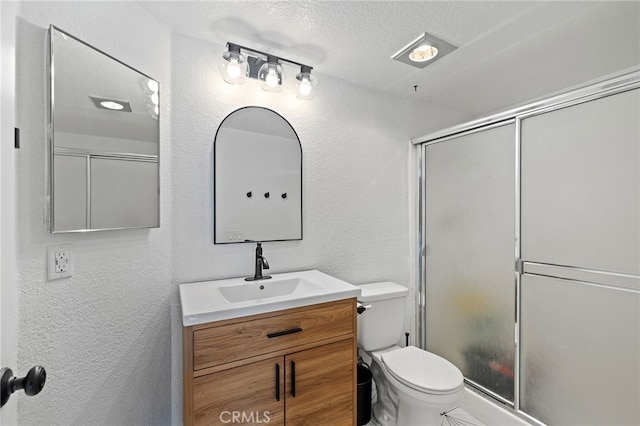 2251 Via Pacifica, Corona, CA 92882 - full bath with a textured wall, vanity, toilet, an enclosed shower, and a textured ceiling