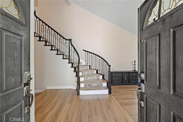 2251 Via Pacifica, Corona, CA 92882 - entrance foyer with stairway, wood finished floors, a high ceiling, and baseboards