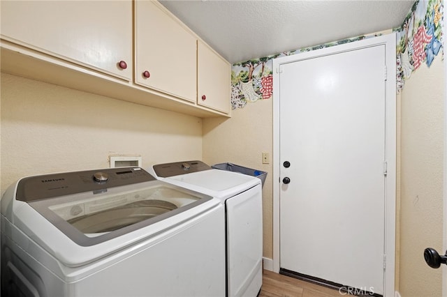 2251 Via Pacifica, Corona, CA 92882 - laundry room featuring washing machine and clothes dryer, cabinet space, and light wood finished floors