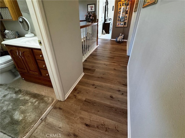 30027 Via Amante, Menifee, CA 92584 - corridor featuring wood finished floors and baseboards