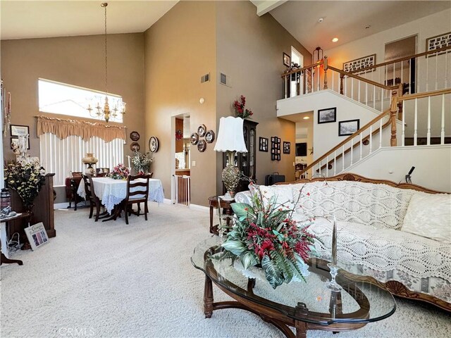 30027 Via Amante, Menifee, CA 92584 - carpeted living area featuring high vaulted ceiling, a chandelier, baseboards, and stairs