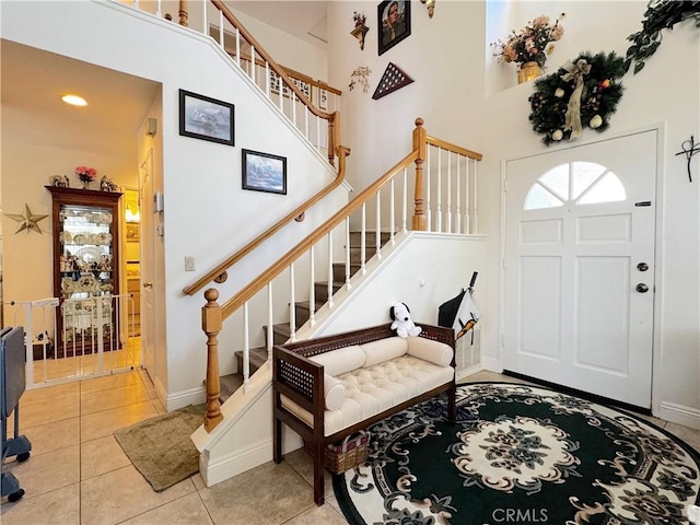 30027 Via Amante, Menifee, CA 92584 - foyer with stairs, light tile patterned floors, a towering ceiling, and baseboards