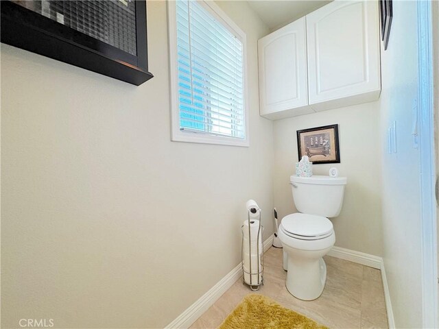30027 Via Amante, Menifee, CA 92584 - bathroom with toilet, baseboards, and tile patterned flooring