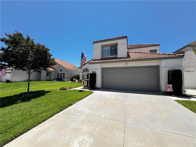 30027 Via Amante, Menifee, CA 92584 - mediterranean / spanish house featuring driveway, stucco siding, a front yard, a tiled roof, and a garage