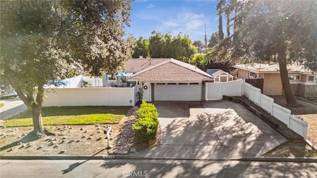 5226 Old Mill Rd, Riverside, CA 92504 - view of front of home featuring concrete driveway and a garage