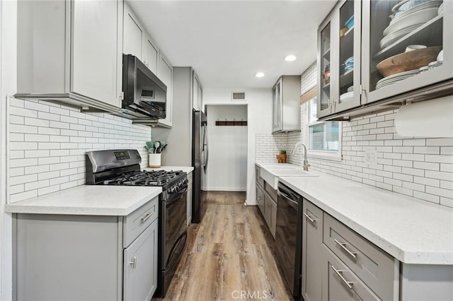5226 Old Mill Rd, Riverside, CA 92504 - kitchen featuring black appliances, gray cabinetry, a sink, tasteful backsplash, and recessed lighting