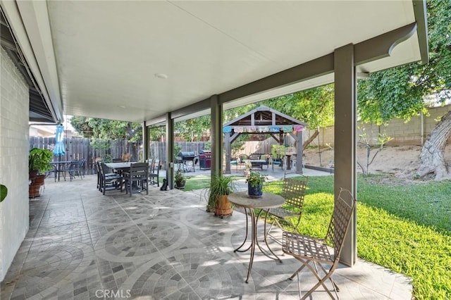 5226 Old Mill Rd, Riverside, CA 92504 - fenced backyard with a gazebo, a patio, and outdoor dining space