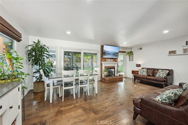 5226 Old Mill Rd, Riverside, CA 92504 - living room with dark wood-style floors, a fireplace with raised hearth, and recessed lighting