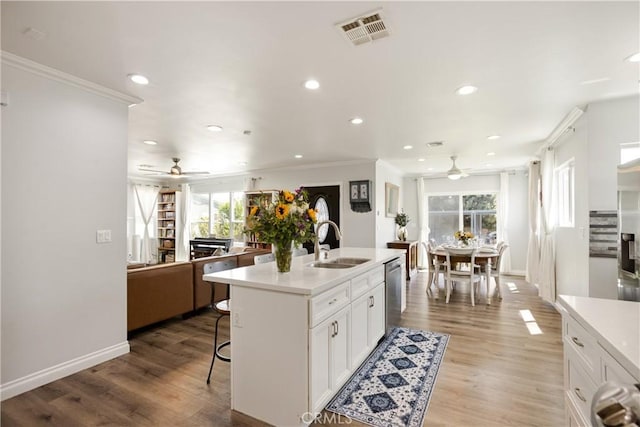 15952 Norcrest Dr, Whittier, CA 90604 - kitchen featuring a ceiling fan, dishwasher, a sink, a breakfast bar area, and ornamental molding