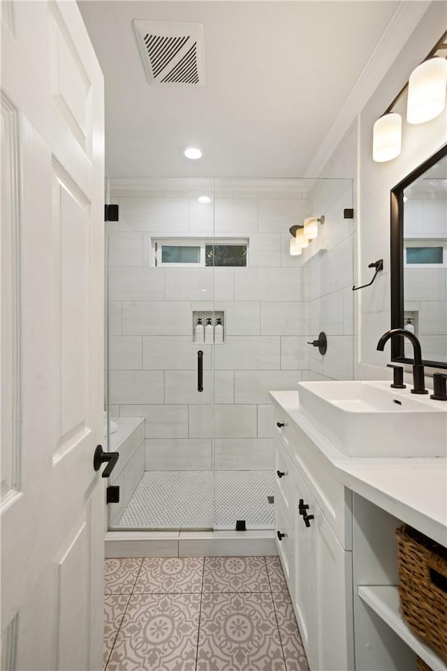 15952 Norcrest Dr, Whittier, CA 90604 - full bathroom featuring crown molding, vanity, tile patterned flooring, a stall shower, and recessed lighting