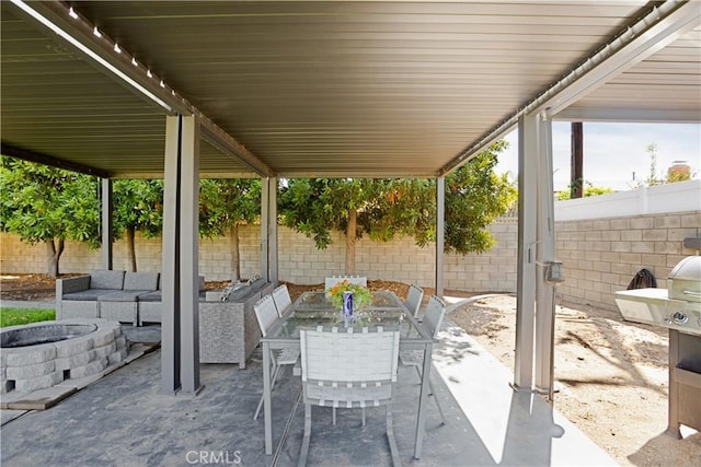 15952 Norcrest Dr, Whittier, CA 90604 - fenced backyard featuring a patio area and an outdoor living space with a fire pit
