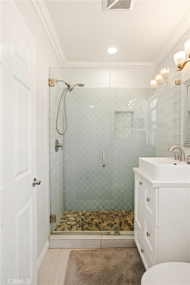 15952 Norcrest Dr, Whittier, CA 90604 - full bathroom with vanity, ornamental molding, a stall shower, and toilet