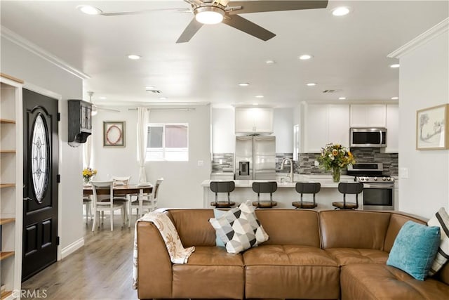 15952 Norcrest Dr, Whittier, CA 90604 - living room featuring ceiling fan, light wood-style floors, crown molding, and recessed lighting