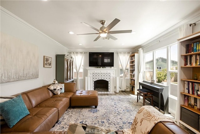 15952 Norcrest Dr, Whittier, CA 90604 - living room featuring ornamental molding, a ceiling fan, a tile fireplace, wood finished floors, and recessed lighting