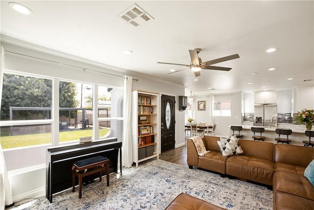 15952 Norcrest Dr, Whittier, CA 90604 - living area with a ceiling fan, recessed lighting, healthy amount of natural light, ornamental molding, and wood finished floors