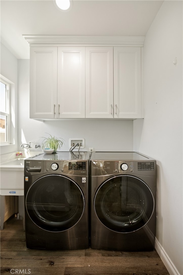 15952 Norcrest Dr, Whittier, CA 90604 - washroom with separate washer and dryer, cabinet space, and wood finished floors
