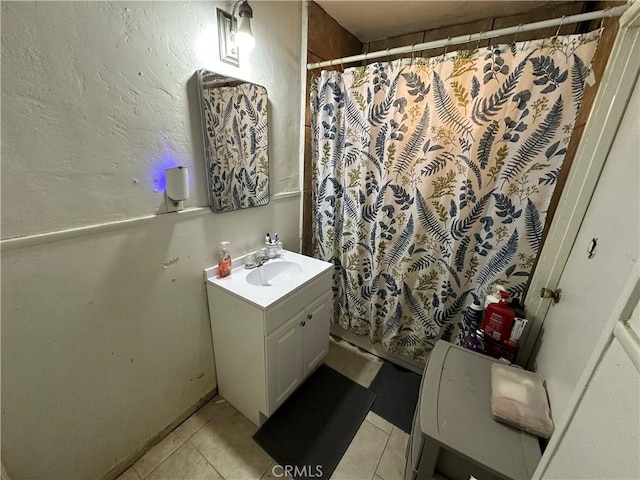 332 S Spring St, Blythe, CA 92225 - full bathroom featuring vanity, tile patterned flooring, and a shower with curtain