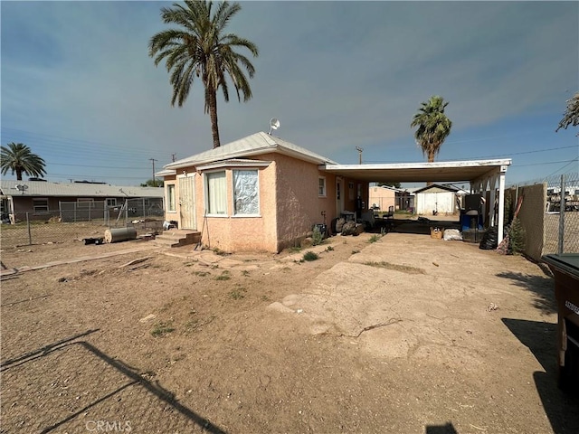 332 S Spring St, Blythe, CA 92225 - view of home's exterior with a carport, stucco siding, and driveway